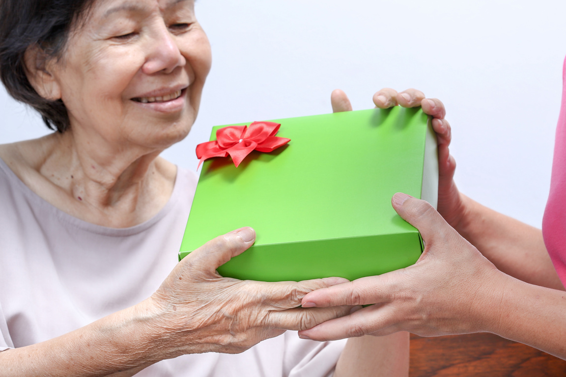 Elderly Woman Receiving a Gift